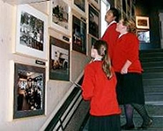 Girls looking at Museum photo collection