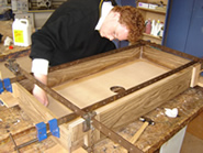 James working on his air-hockey table