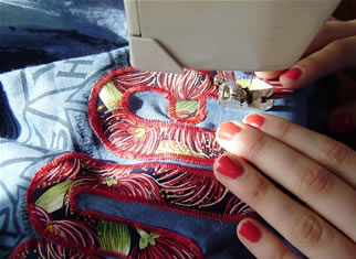 Student sewing a Marae panel