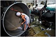 A fabric dyeing factory in Mumbai, India. A group is creating sustainability scores for clothes.