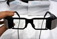New view: These glasses, made by Lumus Optics, can overlay video onto a person's field of vision.