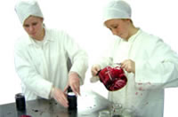 Dale and Emma, filling jars with their topping