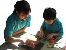 Linnit and Yutao Wei with a finished Monster House Halloween Puzzle.