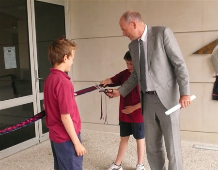 Michael and Angus help Education Minister, Chris Carter open their new school.
