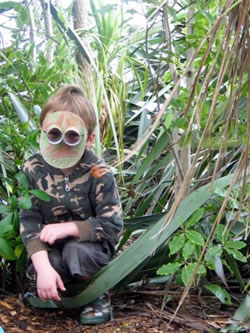 Student wearing camoflage clothing and mask
