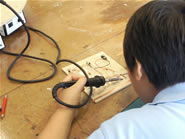 A student soldering