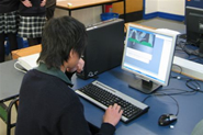 A student working on his project on computer