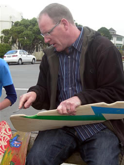 Dave Green examining the finished skateboards