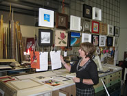 Sue examining a piece