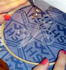 Student sewing a Marae panel