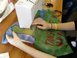 Student sewing a Marae panel