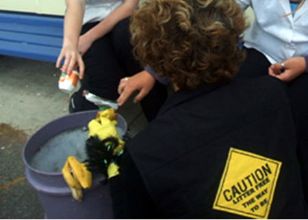 Yulia's teacher and students on rubbish duty