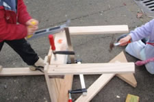 Kindergarten students working on the chairs