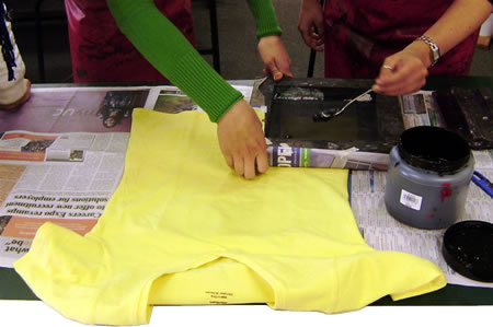 Students screen-printing t-shirts